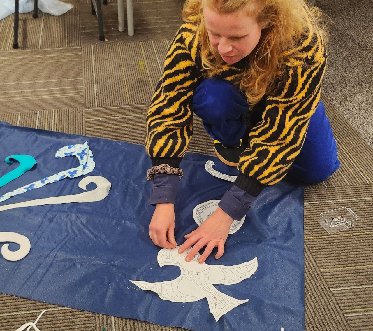 Bridget helps pin the parts down